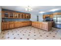 Bright kitchen boasts granite countertops, stainless steel appliances, tile flooring, and plenty of storage at 2338 E Javelina Ave, Mesa, AZ 85204
