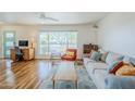 Bright living room with wood floors, a large window, and modern furniture at 314 E Royal Palm Rd, Phoenix, AZ 85020