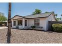 Attractive home showcasing a white brick facade, gray accents, and minimal landscaping at 343 W Santa Cruz Dr, Tempe, AZ 85282