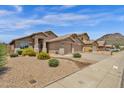 Well maintained single Gathering homes featuring low maintenance desert landscaping at 6602 W Lariat Ln, Phoenix, AZ 85083