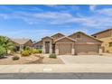 Inviting desert home featuring a two-car garage and xeriscaped front yard at 6602 W Lariat Ln, Phoenix, AZ 85083