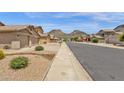 Scenic street view with well-maintained homes, desert landscaping and mountain views at 6602 W Lariat Ln, Phoenix, AZ 85083