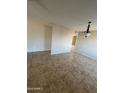 A light and airy living room with tiled floors and modern decorative touches offers a flexible and welcoming space at 662 W Laguna Azul Ave, Mesa, AZ 85210