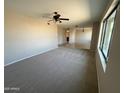 Bright and open floorplan combines carpeted and tiled living spaces, providing an inviting atmosphere at 662 W Laguna Azul Ave, Mesa, AZ 85210