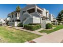 Beautiful exterior of a two-story home with a well-manicured lawn and landscaped shrubbery at 850 S River Dr # 2065, Tempe, AZ 85281