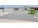 Charming single-story home with a low-maintenance, xeriscaped front yard and attached one car garage at 1017 S Allen --, Mesa, AZ 85204