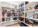 Walk-in pantry featuring abundant shelving and storage space for an organized kitchen at 10221 E Wavelength Ave, Mesa, AZ 85212