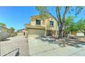 This two-story home has a two-car garage with a well-kept yard at 10524 W Pima St, Tolleson, AZ 85353