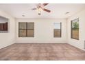 Bright and spacious living room featuring tile flooring and natural light at 11826 W Villa Hermosa Ln, Sun City, AZ 85373