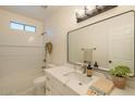 Bathroom showcasing updated fixtures, a new vanity, and tiled shower-tub combo at 125 N 22Nd Pl # 5, Mesa, AZ 85213