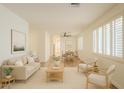 Inviting living room and dining room featuring neutral tones, wood floors, and shuttered windows at 125 N 22Nd Pl # 5, Mesa, AZ 85213