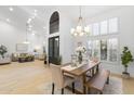 Elegant dining area featuring high ceilings, large windows, and an open floor plan at 12638 E Cortez Dr, Scottsdale, AZ 85259