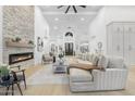 Expansive living space with stone fireplace, comfortable seating, and ample natural light at 12638 E Cortez Dr, Scottsdale, AZ 85259