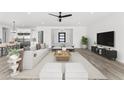 Bright living room with modern furniture and an open floor plan at 1785 W Brooke Ln, Queen Creek, AZ 85144