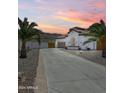 Stunning single-story home featuring a tile roof, desert landscaping, and a long driveway at 1809 E Gwen St, Phoenix, AZ 85042