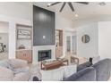 Stylish living room with elegant fireplace and comfortable seating at 18812 N 90Th Pl, Scottsdale, AZ 85255