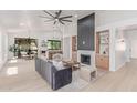 Open-concept living room with modern fireplace and ample natural light at 18812 N 90Th Pl, Scottsdale, AZ 85255
