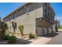 Wide angle view showing exterior features garages, walkway and entryways of building 1457 at 2402 E 5Th St # 1457, Tempe, AZ 85288