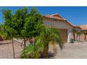 Charming single-story home featuring a two-car garage, low maintenance landscaping, and a terracotta tile roof at 2896 W Hayden Peak Dr, San Tan Valley, AZ 85144