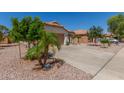 Charming single-story home with desert landscaping, two-car garage, driveway and terracotta tile roof at 2896 W Hayden Peak Dr, San Tan Valley, AZ 85144