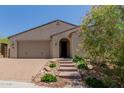 Charming single-story home features a low-maintenance desert landscape and neutral color palette at 34009 N 29Th Dr, Phoenix, AZ 85085