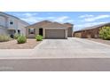 Beautiful home featuring manicured landscaping, a driveway, and a two-car garage at 4091 W Suncup Dr, San Tan Valley, AZ 85144