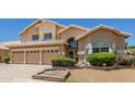 Charming two-story home with a three-car garage and a well-manicured front lawn at 728 W Sandra Ter, Phoenix, AZ 85023