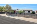 Inviting residence with an enclosed front yard and decorative block fence at 8202 W Turney Ave, Phoenix, AZ 85033