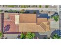 Aerial view of the house showing the roof, backyard with gravel, and surrounding landscape at 885 E Lakeview Dr, San Tan Valley, AZ 85143