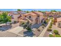 Two-story home with neutral stucco, tile roof, desert landscaping, and a two car garage at 885 E Lakeview Dr, San Tan Valley, AZ 85143