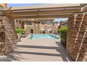 Community pool with ample lounge chairs offers an inviting retreat for residents at 14450 N Thompson Peak Pkwy # 132, Scottsdale, AZ 85260