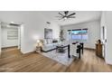 Bright living room features wood floors, vaulted ceilings, modern decor, and large windows at 1720 W Highland St, Chandler, AZ 85224