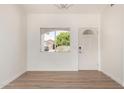 Bright entryway featuring a new door, window, and stylish flooring at 1727 W 12Th Ave, Apache Junction, AZ 85120