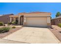Inviting single-Gathering home featuring desert landscaping, arched entryway, and two-car garage at 17805 W Arizona Dr, Surprise, AZ 85374