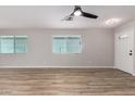 Spacious living room with new hardwood floors, recessed lighting, and large windows at 3014 W Zachary Dr, Phoenix, AZ 85027