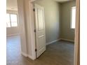 Neutral bedroom featuring tiled floors and a window allowing for natural light at 31762 N Bandit Rd, San Tan Valley, AZ 85143