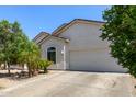 A beautiful single story home with desert landscaping and a large driveway with a two car garage at 3553 W Dancer Ln, San Tan Valley, AZ 85144
