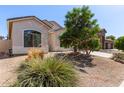 An attractive single story home with desert landscaping and an attached two car garage at 3553 W Dancer Ln, San Tan Valley, AZ 85144