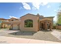 Stunning home with a stone entrance, spacious garage, gravel landscaping, and beautiful architectural details at 3804 E Camelback Rd, Phoenix, AZ 85018