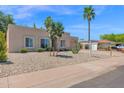 Inviting home with desert landscaping and a 'coming soon' sign, framed by palm trees and blue sky at 3919 E Larkspur Dr, Phoenix, AZ 85032