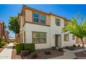 Charming two-story residence with earth-tone accents, complemented by well-maintained desert landscaping at 503 N Ranger Trl, Gilbert, AZ 85234