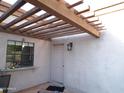 Covered patio area featuring a private entrance and a window with a view at 5323 W North Ln, Glendale, AZ 85302