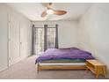 Bright bedroom with access to the balcony with a sliding glass door at 609 E Mesquite Cir # D133, Tempe, AZ 85288