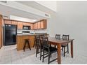 Eat-in kitchen with stainless steel appliances, skylight, and tile floors at 609 E Mesquite Cir # D133, Tempe, AZ 85288