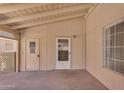 Cozy covered patio with dual access points and a shaded area at 6461 S Oakmont Dr, Chandler, AZ 85249