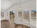Bright living room with wood flooring, recessed lights, large windows, and sliding door at 6461 S Oakmont Dr, Chandler, AZ 85249