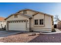 Charming single-story home with desert landscaping, featuring a two-car garage and a well-maintained stucco exterior at 8566 N 108Th Ln, Peoria, AZ 85345