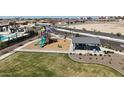 Community playground featuring colorful slides and a covered picnic area for Gathering enjoyment at 15842 W Miami St, Goodyear, AZ 85338