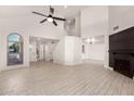 Open-concept living space featuring tile floors, high ceilings, and seamless flow into the kitchen at 1621 N Chippewa Dr, Chandler, AZ 85224