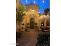 Private courtyard with stone pavers, string lights, and outdoor seating area at 20502 W Ridge Rd, Buckeye, AZ 85396